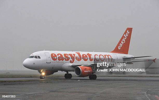 An Easyjet passenger aircraft taxis on the runway after landing at Berlin's Schoenefeld airport on December 17, 2008. AFP PHOTO JOHN MACDOUGALL
