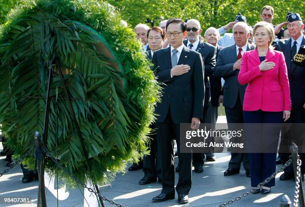 Korean President Lee Myung-bak and U.S. Secretary of State Hillary Rodham Clinton put their hands on their hearts after Lee laid a wreath during his...