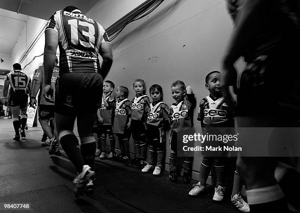 This image has been changed to Black and White. Junior footballers wait in the tunnel before the round five NRL match between the Parramatta Eels and...