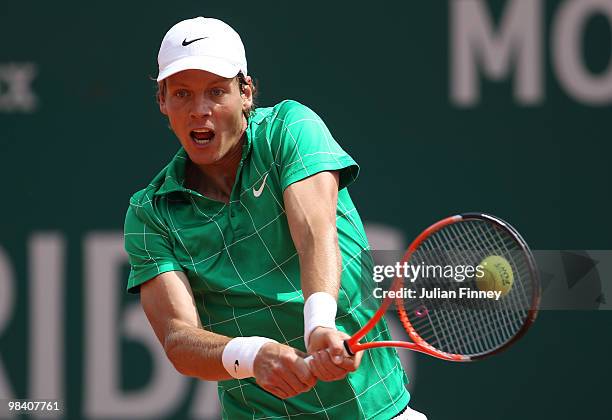 Tomas Berdych of Czech Republic plays a backhand in his match against Feliciano Lopez of Spain during day one of the ATP Masters Series at the Monte...