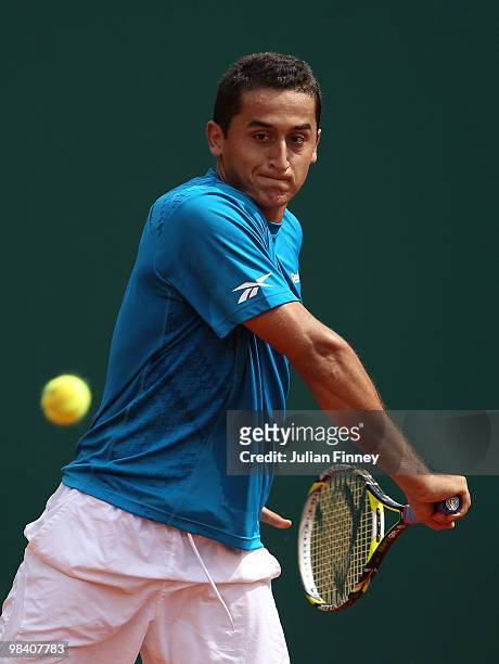 Nicolas Almagro of Spain plays a backhand in his match against Simon Greul of Germany during day one of the ATP Masters Series at the Monte Carlo...