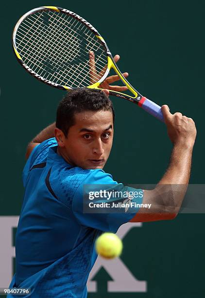 Nicolas Almagro of Spain plays a backhand in his match against Simon Greul of Germany during day one of the ATP Masters Series at the Monte Carlo...