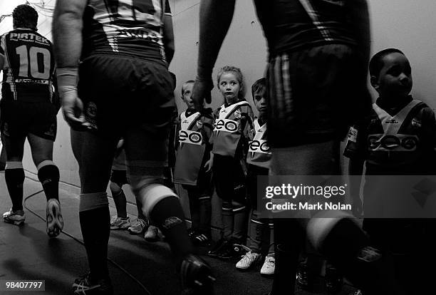 This image has been changed to Black and White. Junior footballers wait in the tunnel before the round five NRL match between the Parramatta Eels and...