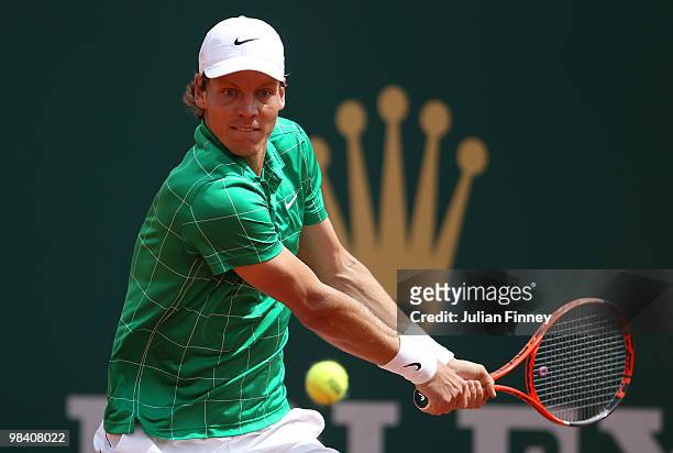 Tomas Berdych of Czech Republic plays a backhand in his match against Feliciano Lopez of Spain during day one of the ATP Masters Series at the Monte...
