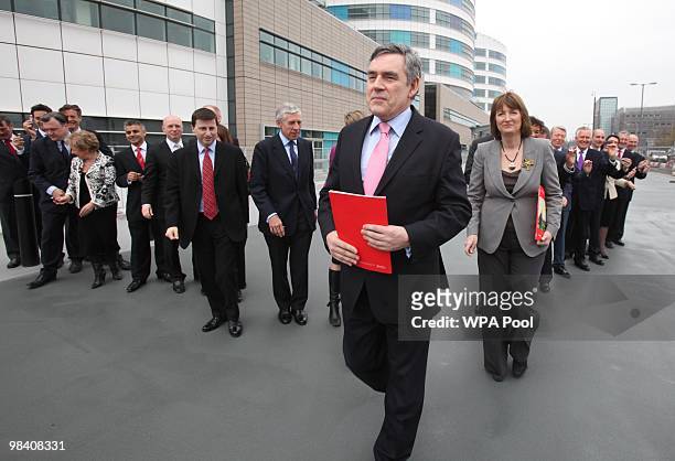 Prime Minister Gordon Brown stands in front of cabinet members as he launches the Labour Party election manifesto at The Queen Elizabeth Hospital on...