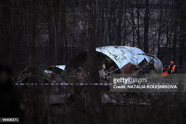 Russian rescuers workers attend the site where a Polish government Tupolev Tu-154 aircraft crashed on April 10, near Smolensk airport on April 11,...