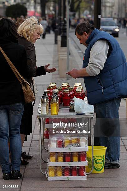 Man sells candles near the Presidential Palace where mourners were lighting them by the thousands in memory of late Polish President Lech Kaczynski...