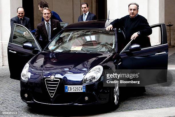 Luca Cordero di Montezemolo, chairman of Fiat SpA, second from left, and Sergio Marchionne, chief executive officer of Fiat SpA, right, pose with the...
