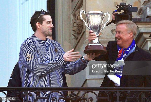 Guillaume Gille of Hamburg and Ole von Beust, mayor of Hamburg celebrate with the cup at the Hamburg townhall after winning the DHB German Cup final...