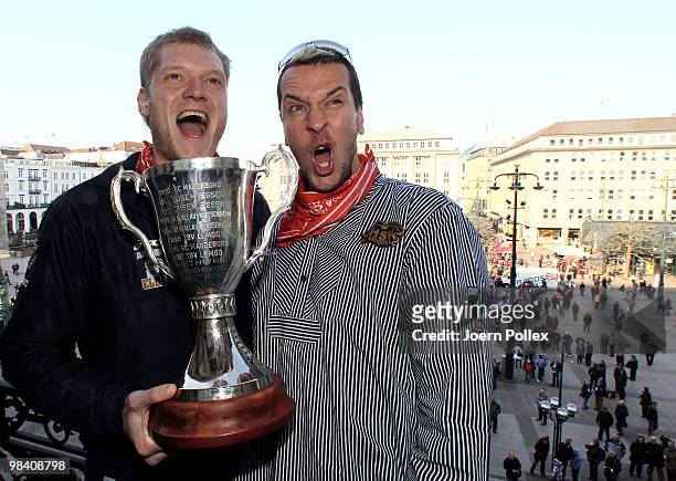 Pascal Hens and Johannes Bitter of Hamburg celebrate with the cup at the Hamburg townhall after winning the DHB German Cup final match between HSV...