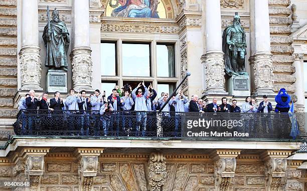 The team of Hamburg celebrate with the cup at the Hamburg townhall after winning the DHB German Cup final match between HSV Handball and Rhein Neckar...