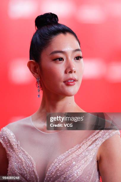 Model/actress Clara Lee poses on the red carpet of the Golden Goblet Awards Ceremony during the 21st Shanghai International Film Festival on June 24,...