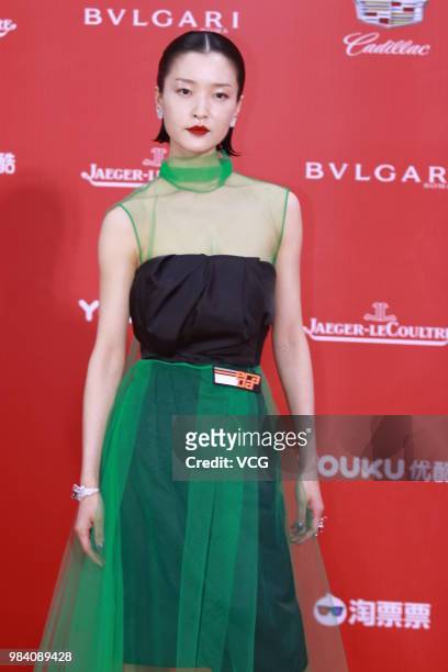 Model/actress Du Juan poses on the red carpet of the Golden Goblet Awards Ceremony during the 21st Shanghai International Film Festival on June 24,...