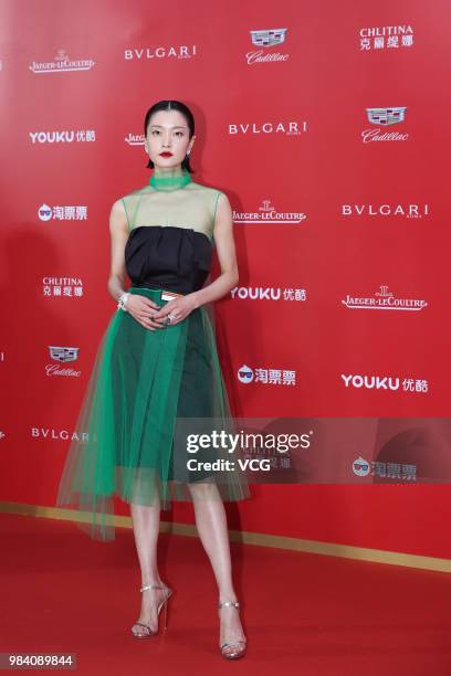 Model/actress Du Juan poses on the red carpet of the Golden Goblet Awards Ceremony during the 21st Shanghai International Film Festival on June 24,...