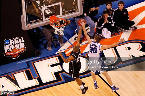 Willie Veasley of the Butler Bulldogs has his shot attempt blocked by Jon Scheyer of the Duke Blue Devils during the 2010 NCAA Division I Men's...