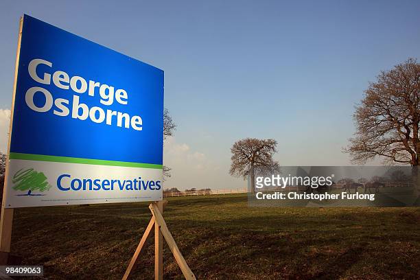 Campaign poster for conservative shadow chancellor George Osborne stands in a field in Cheshire on April 12, 2010 in Knutsford, United Kingdom. The...