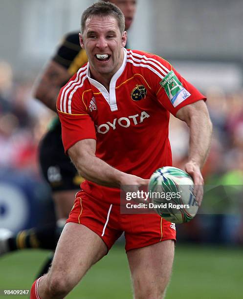 Tomas O'Leary of Munster passes the ball during the Heineken Cup quarter final match between Munster and Northampton Saints at Thomond Park on April...