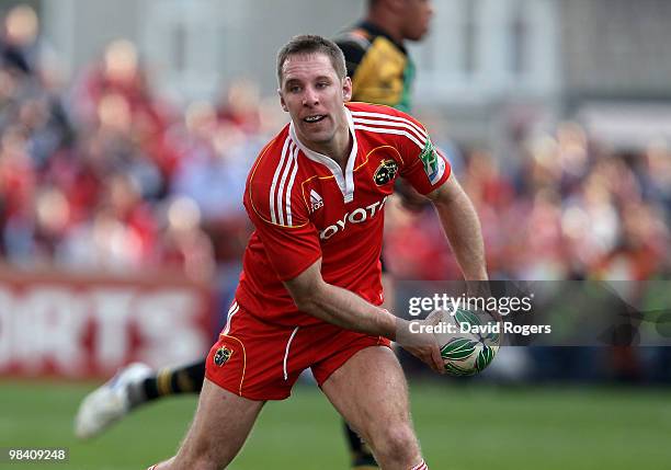 Tomas O'Leary of Munster passes the ball during the Heineken Cup quarter final match between Munster and Northampton Saints at Thomond Park on April...