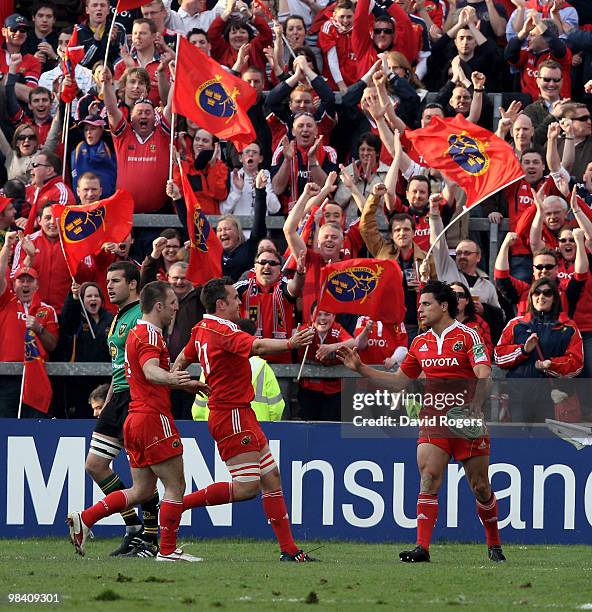 Doug Howlett is congratulated by team mates Niall Ronan and Tomas O'Leary after scoring a try during the Heineken Cup quarter final match between...