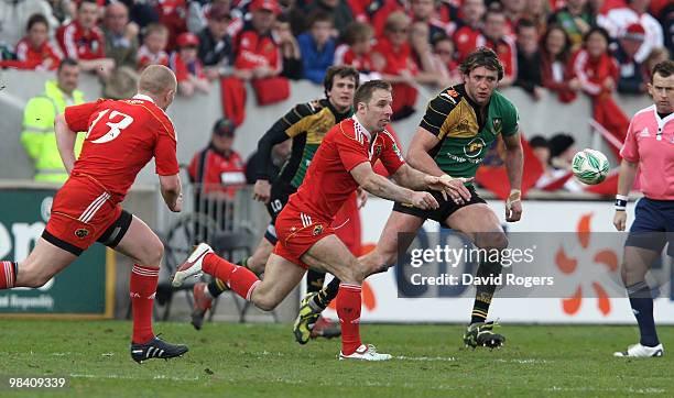 Tomas O'Leary of Munster passes the ball during the Heineken Cup quarter final match between Munster and Northampton Saints at Thomond Park on April...