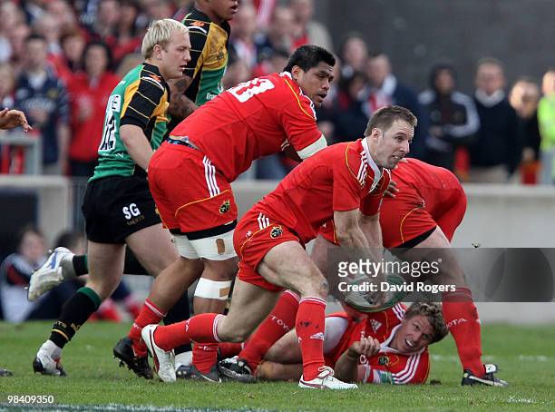 Tomas O'Leary of Munster passes the ball during the Heineken Cup quarter final match between Munster and Northampton Saints at Thomond Park on April...
