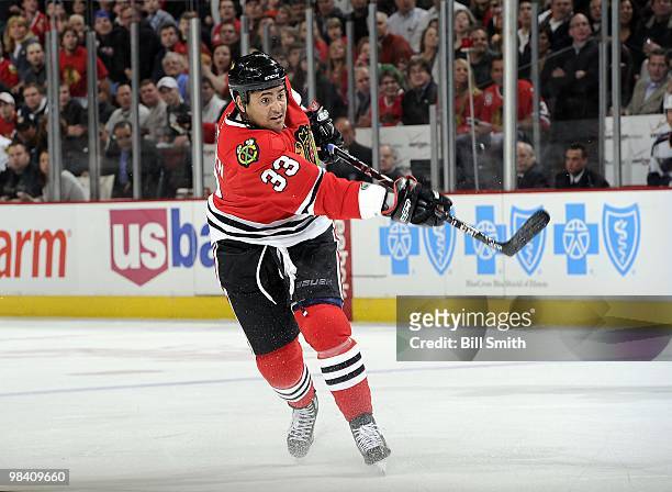 Dustin Byfuglien of the Chicago Blackhawks shoots the puck during a game against the St. Louis Blues on April 07, 2010 at the United Center in...