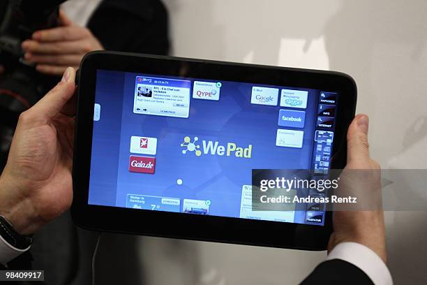 Man holds up a 'WePad' during the launch of the new 'WePad' - a mobile tablet browsing device on April 12, 2010 in Berlin, Germany. The soft-launch...