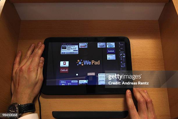 Man touches on a 'WePad' during the launch of the new 'WePad' - a mobile tablet browsing device on April 12, 2010 in Berlin, Germany. The soft-launch...
