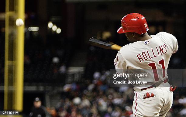 Jimmy Rollins of the Philadelphia Phillies singles to right field against the Houston Astros at Minute Maid Park on April 9, 2010 in Houston, Texas.