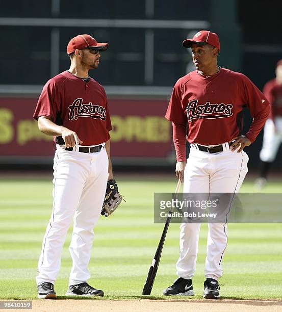 Third baseman Pedro Feliz, left, talks with first base coach Bobby Meacham during batting practice at Minute Maid Park on April 9, 2010 in Houston,...
