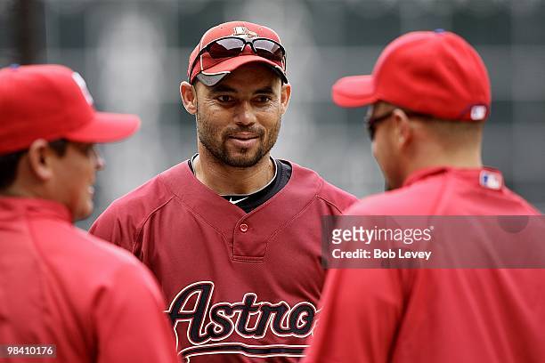 Pedro Feliz, center, of the Houston Astros chats with old teammates from the Philadelphia Phillies during batting practice at Minute Maid Park on...