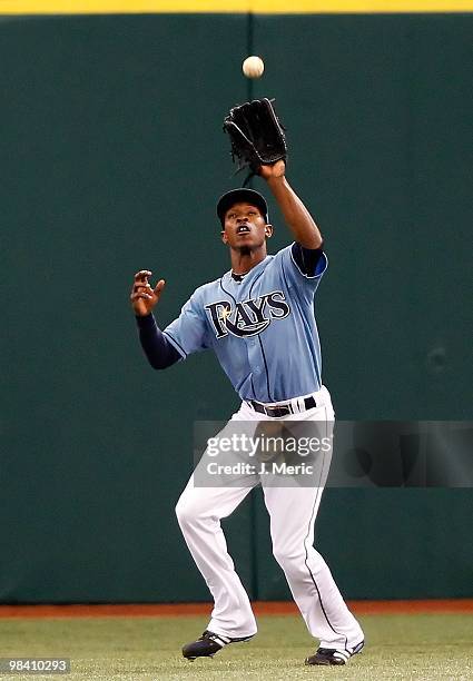 Outfielder B.J. Upton of the Tampa Bay Rays catches a fly ball against the New York Yankees during the game at Tropicana Field on April 11, 2010 in...