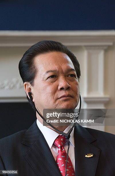 Vietnamese Prime Minister Nguyen Tan Dung listens to US Vice President Joe Biden address leaders at the Naval Observatory, the vice president's...