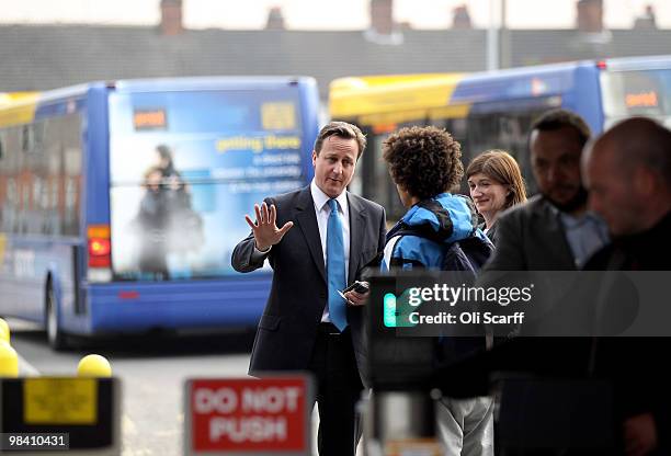Conservative party leader David Cameron speaks to members of the public at Loughborough train station after delivering a speech in the town's Market...
