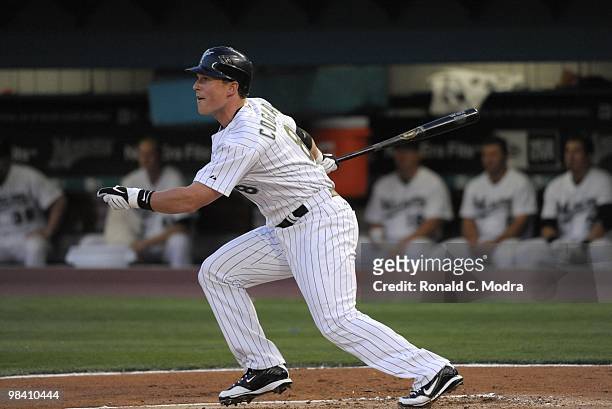 Chris Coghlan of the Florida Marlins bats against the Los Angeles Dodgers during the Marlins home MLB opening game at Sun Life Stadium on April 9,...