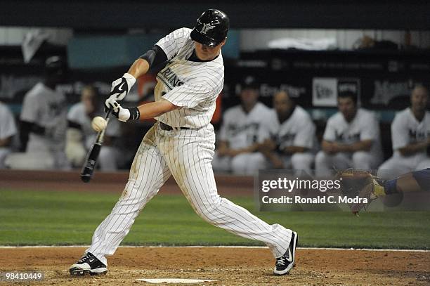 Chris Coghlan of the Florida Marlins bats against the Los Angeles Dodgers during the Marlins home MLB opening game at Sun Life Stadium on April 9,...