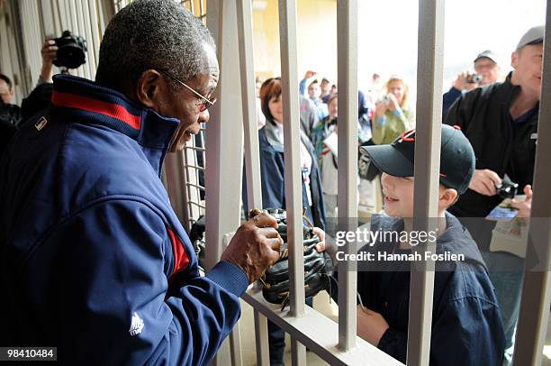 Rod Carew hall of famer of the Minnesota Twins talks to a fan through Gate 29 prior to a game between the Minnesota Twins and the Boston Red Sox...