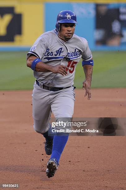 Rafael Furcal of the Los Angeles Dodgers runs to third base against the Florida Marlins during the Marlins home opening game at Sun Life Stadium on...