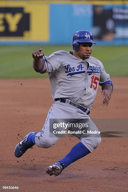 Rafael Furcal of the Los Angeles Dodgers slides into third base against the Florida Marlins during the Marlins home opening game at Sun Life Stadium...