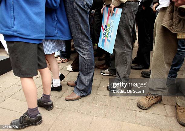 Conservative party supporters hold placards in Loughborough's Market Place as they await party leader David Cameron on April 12, 2010 in...