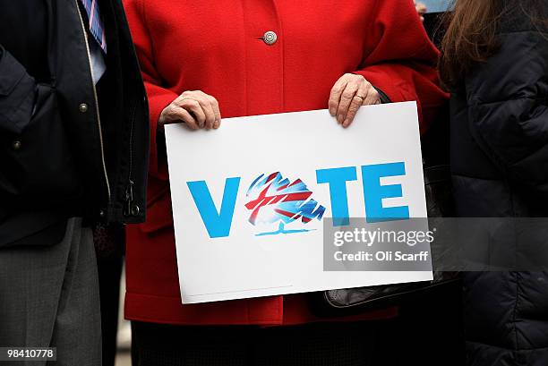 Conservative party supporter hold a placard in Loughborough's Market Place as they await party leader David Cameron on April 12, 2010 in...