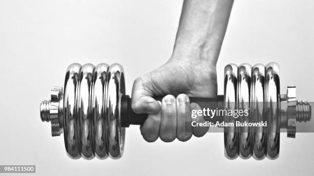 lifting dumbbell - bukowski stock pictures, royalty-free photos & images