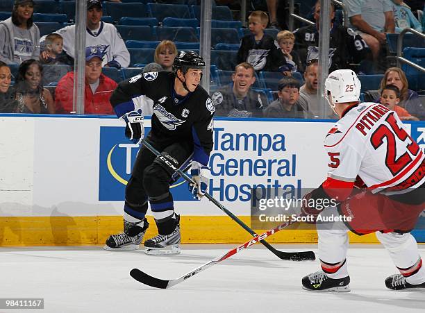 Vincent Lecavalier of the Tampa Bay Lightning passes the puck against the Carolina Hurricanes at the St. Pete Times Forum on April 6, 2010 in Tampa,...