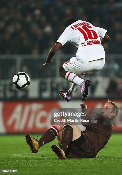 Marius Ebbers of St. Pauli and Ibrahima Traore of Augsburg battle for the ball during the Second Bundesliga match between FC St. Pauli and FC...