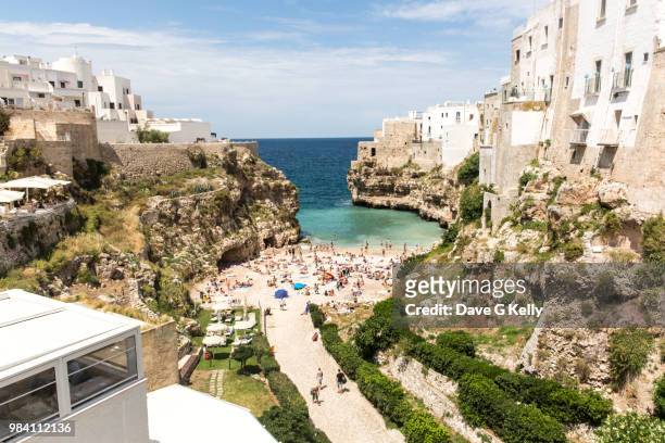 clifftop coastal town beach - italy beach stock pictures, royalty-free photos & images