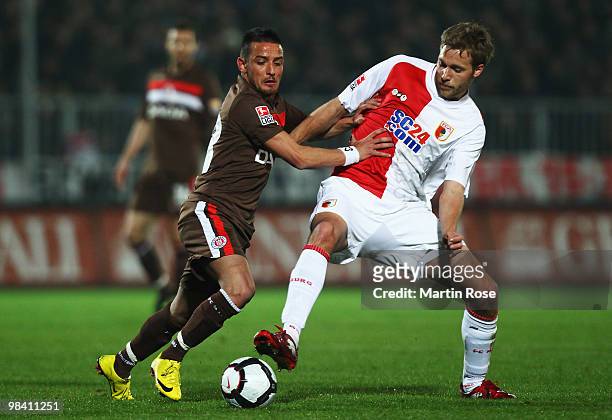 Deniz Naki of St. Pauli and Daniel Brinkmann of Augsburg battle for the ball during the Second Bundesliga match between FC St. Pauli and FC Augsburg...