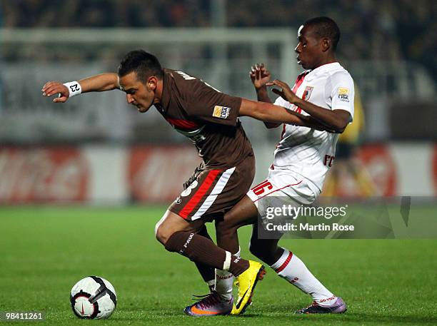 Deniz Naki of St. Pauli and Ibrahima Traore of Augsburg battle for the ball during the Second Bundesliga match between FC St. Pauli and FC Augsburg...