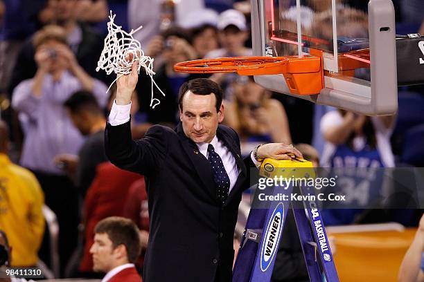 Head coach Mike Krzyzewski of the Duke Blue Devils celebrates after he cut down a piece of the net following their 61-59 win against the Butler...