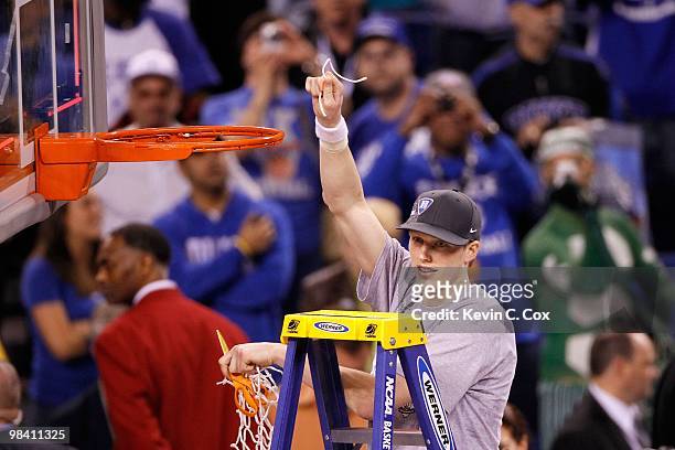 Kyle Singler of the Duke Blue Devils celebrates after he cut down a piece of the net following their 61-59 win against the Butler Bulldogs during the...