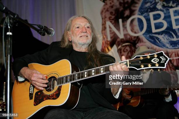 Willie Nelson performs at the Nobelity Project's dinner honoring him with the "Feed The Peace" award at the Four Seasons Hotel on April 11, 2010 in...